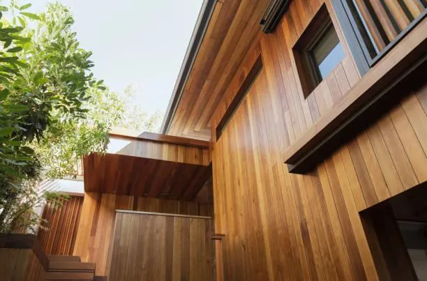 Beautiful cedar wood siding on a home, enhancing aesthetic appeal and providing natural insulation