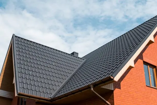 Energy-efficient metal roof reflecting sunlight, contributing to lower home energy costs and sustainable living.