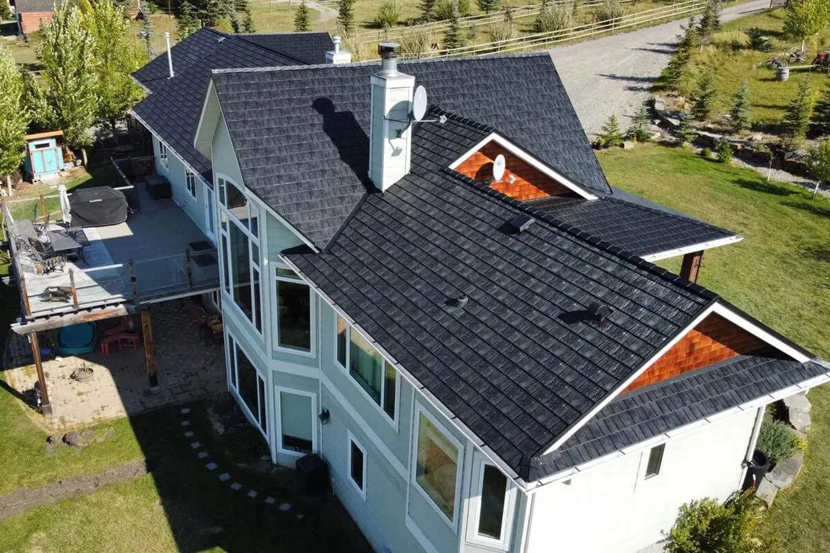 Aerial view of a home with newly installed rubber roofing by Home Star Roofing, showing the comprehensive coverage and neat finish.