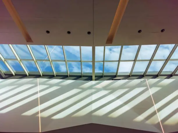 Skylight installation in progress, with Home Star Roofing's technician ensuring proper placement and sealing for energy efficiency