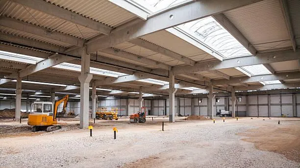 Interior of a commercial space with high ceilings and natural light provided by newly installed skylights from Home Star Roofing.