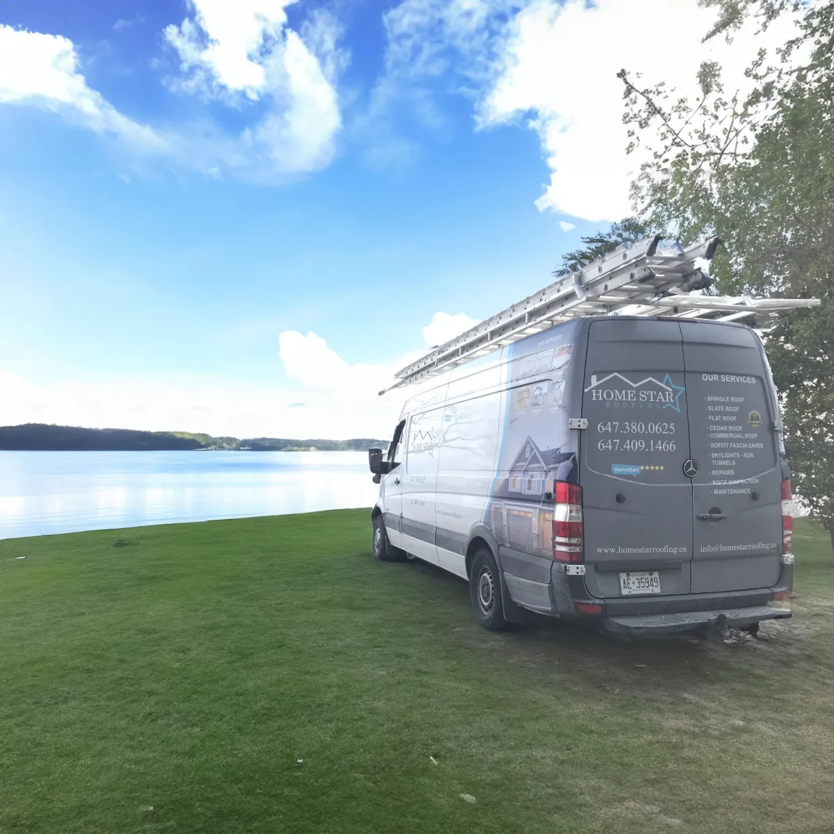 Home Star Roofing van parked on a serene lakeside property, showcasing the company's readiness to provide roofing services in beautiful locations