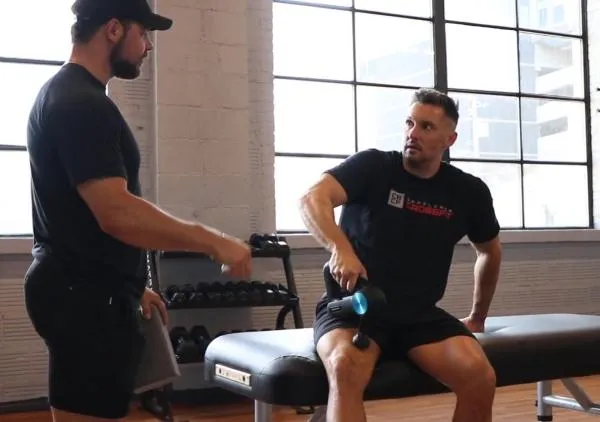 Theragun and coach in Nashville QNTM Fit Life