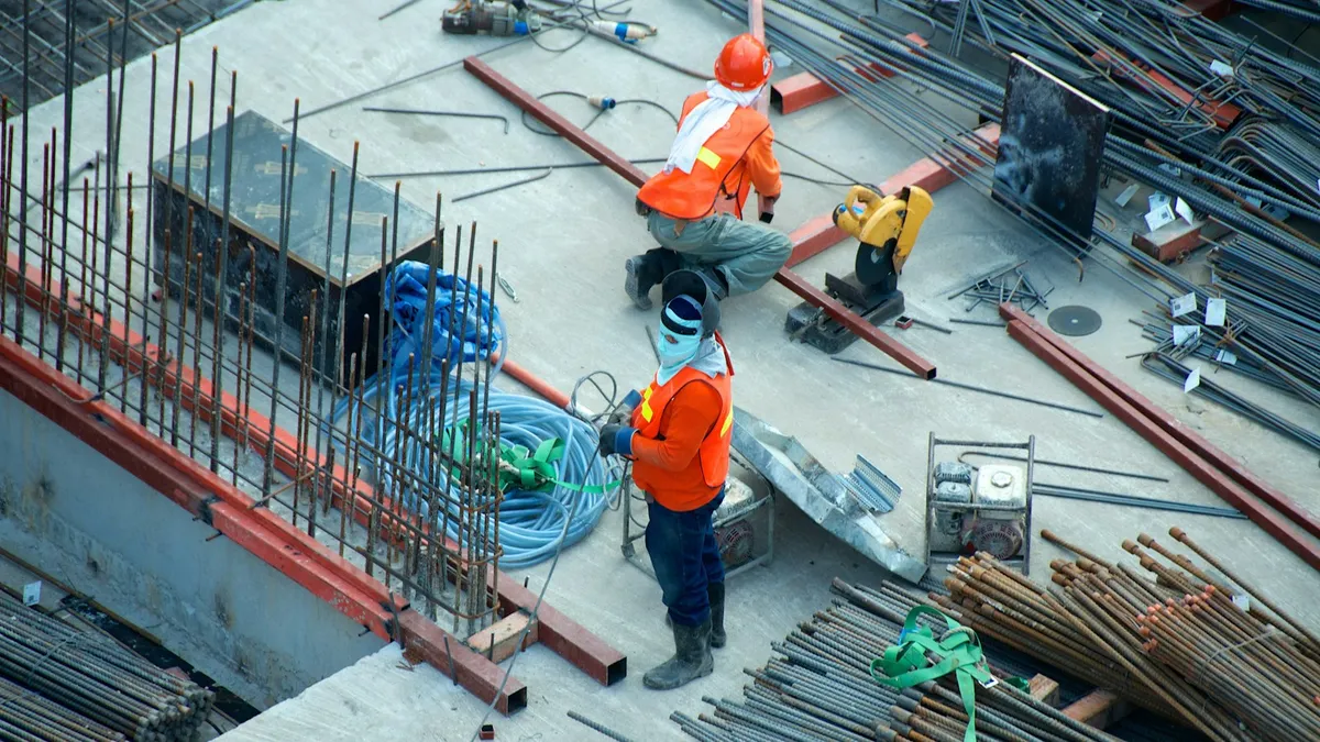 Construction crew in safety gear working on a job site