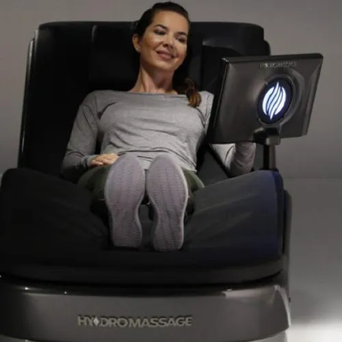 Woman enjoying HydroMassage chair.