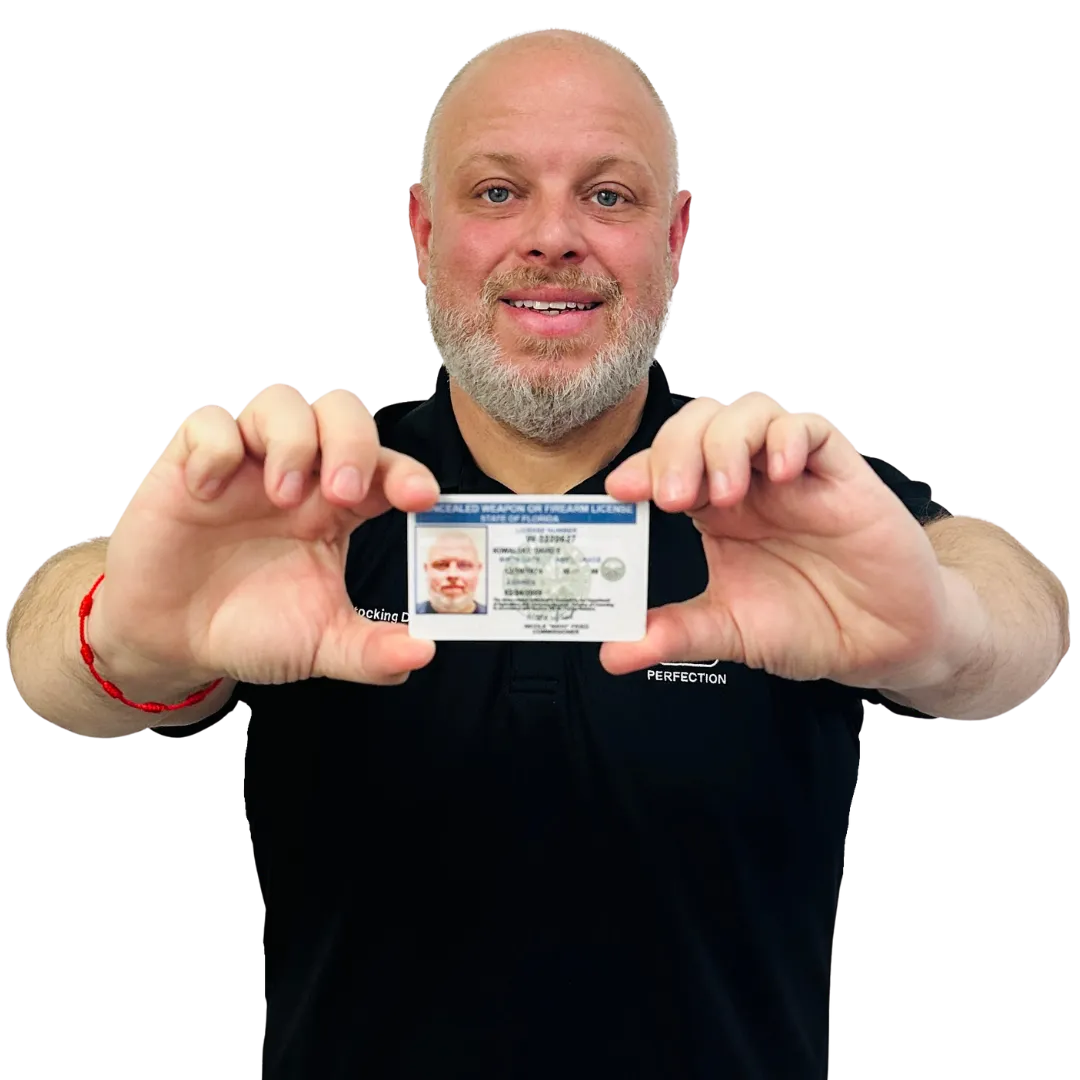 Certified NRA Instructor David Kowalsky holding concealed permit