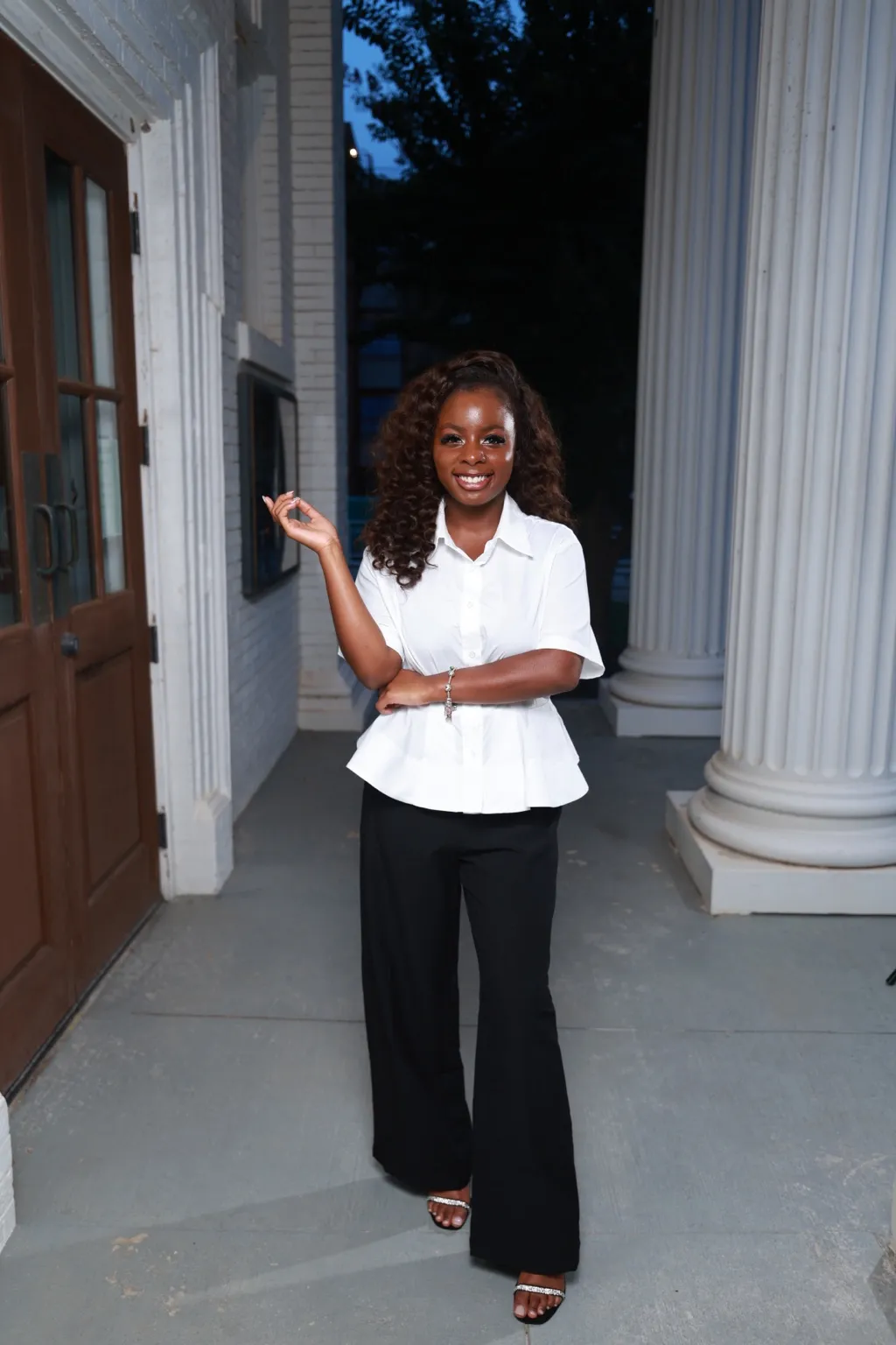 Liyah Joseph, Operations Manager, wearing a white blouse and black trousers