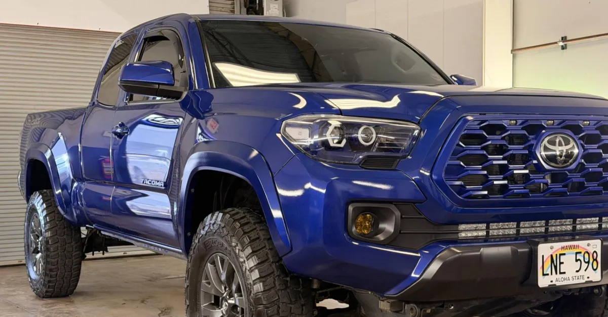 Blue Toyota Tacoma after professional paint preparation and ceramic coating in Kihei.