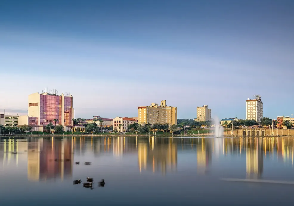 Lakeland skyline reflected on Lake Mirror at dawn