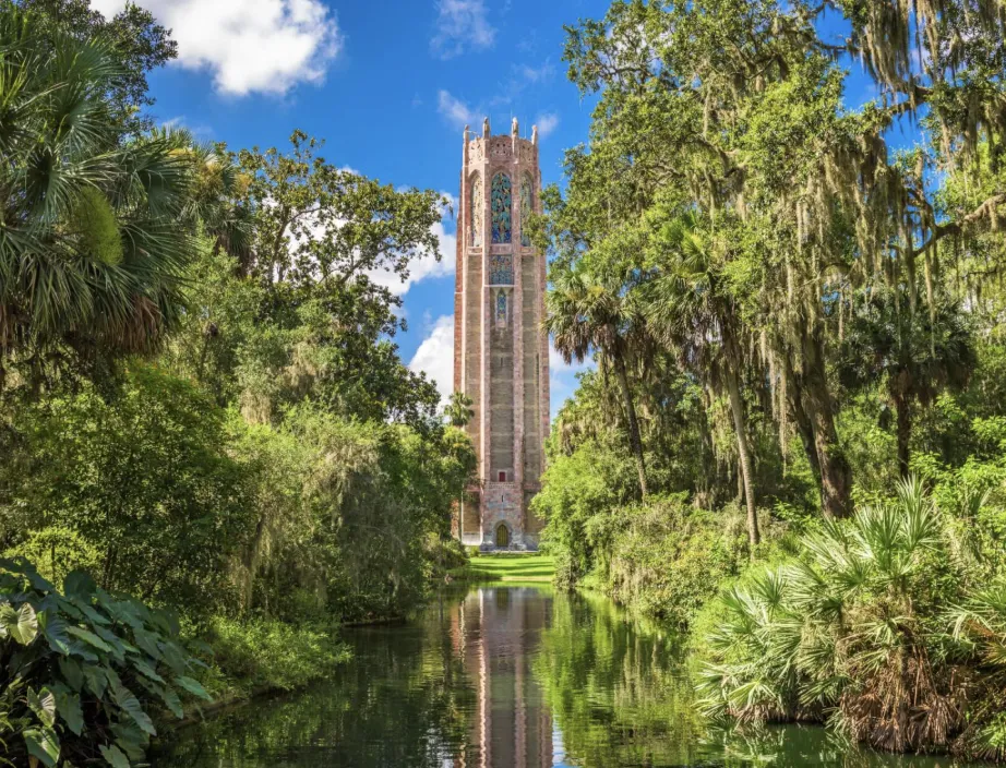 Bok Tower rising above gardens and a reflecting pool in Lake Wales, Florida