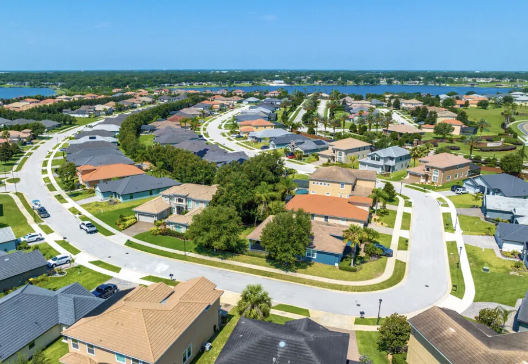 Aerial view of curving suburban streets and homes in Auburndale, Florida