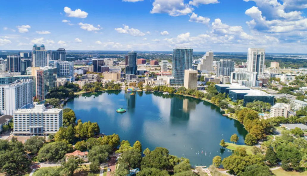 Aerial of downtown waterfront with lake and high-rises in Kissimmee, Florida