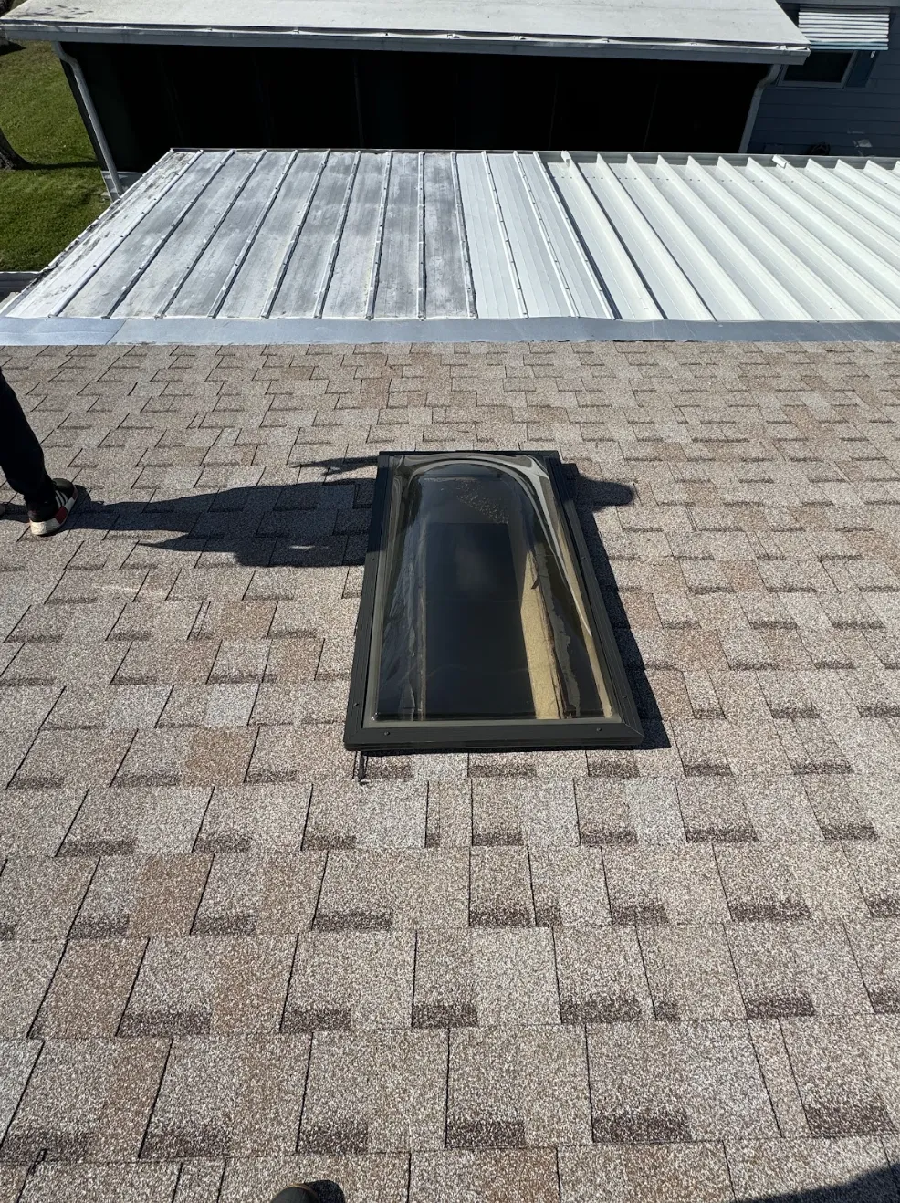 Red clay tile roof installation in progress on residential property.