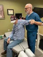 Dr. Andy Barlow DC. adjusting patient tupelo Mississippi
