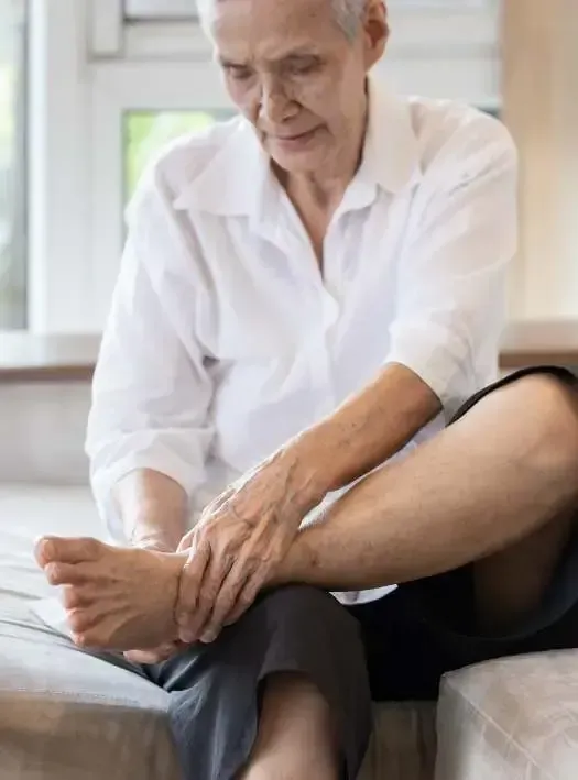 senior man with nerve pain on foot Chiropractic Physician Center of Tupelo