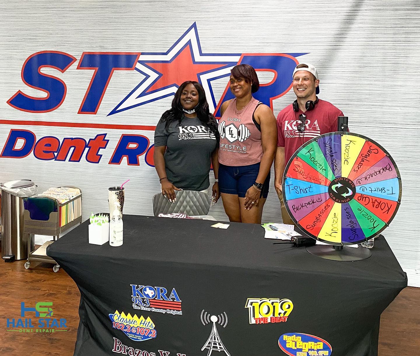 Action shot of two technicians aligning a bumper in a well-lit bay with tools arranged neatly, photorealistic, dynamic angle.