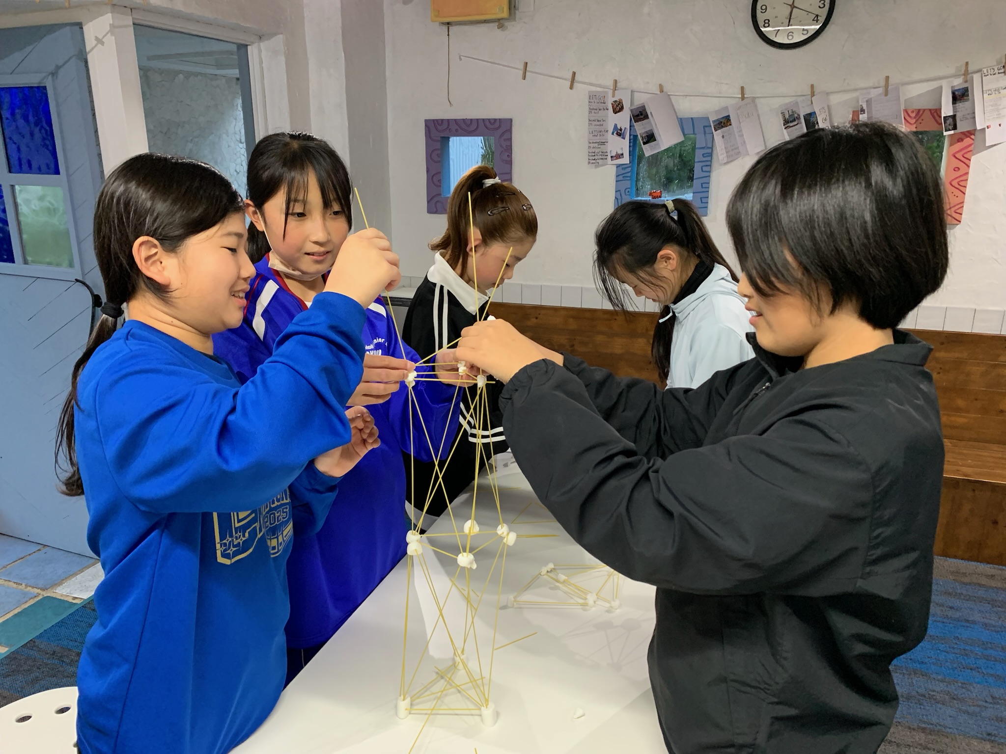 Students working together to build a tower