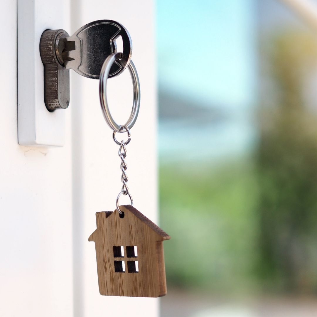 key in the door of an Airbnb property 