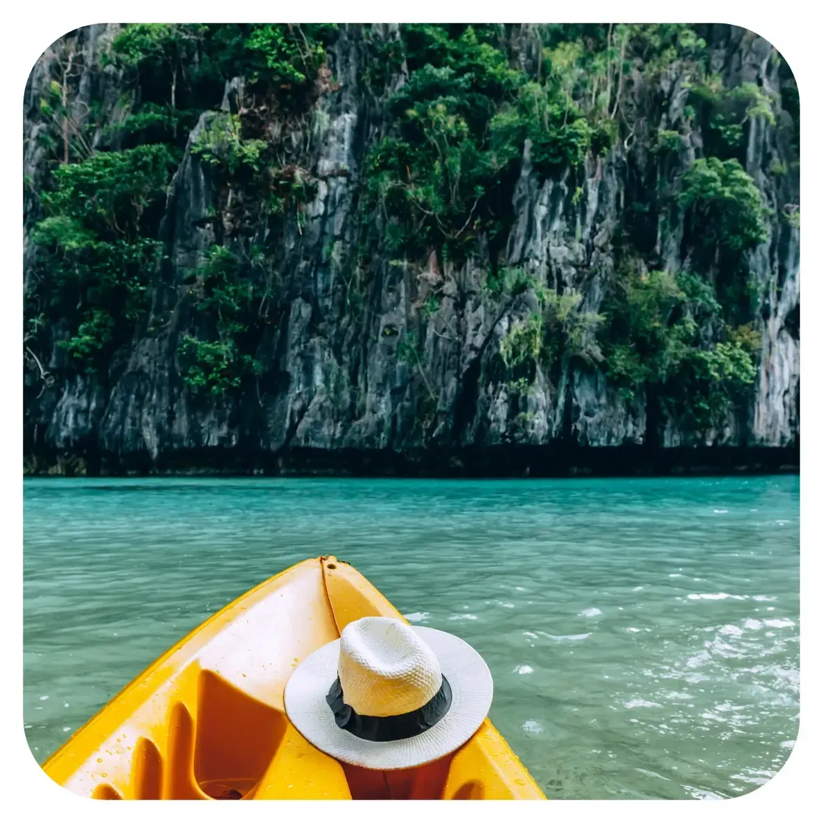 yellow boat during island hopping in el nido