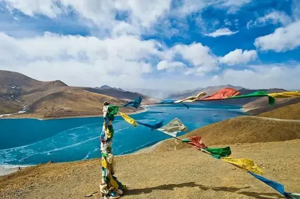 woman in black dress sitting on concrete floor