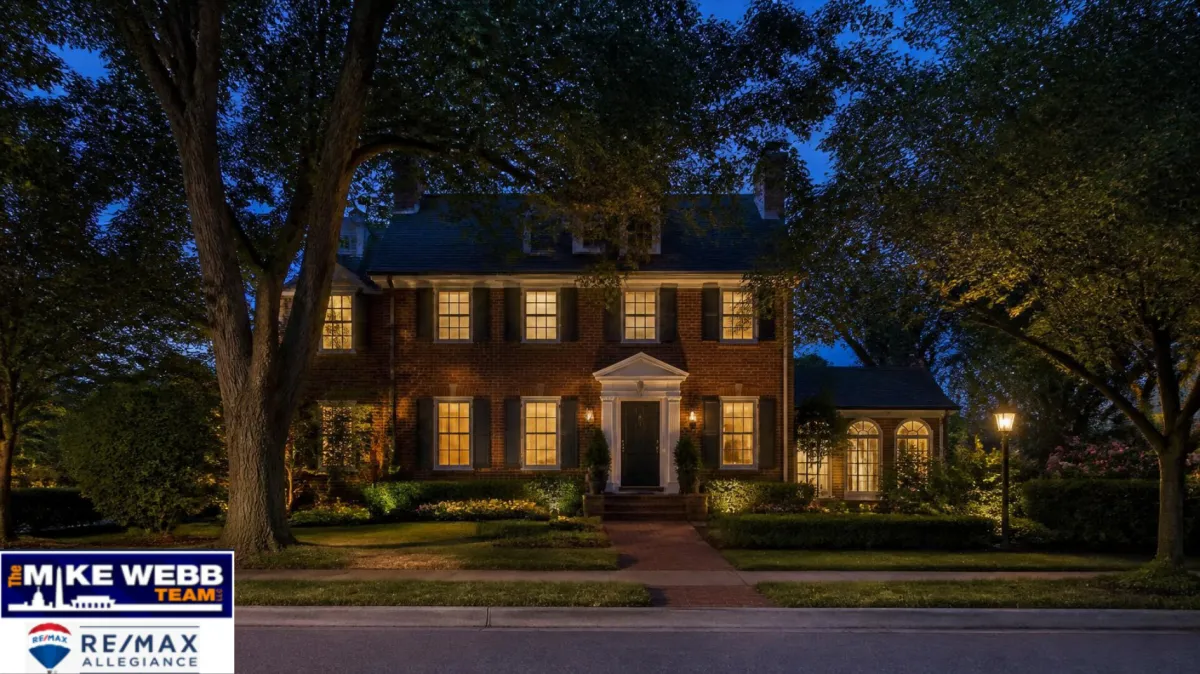 Classic older Arlington brick home at twilight with text overlay