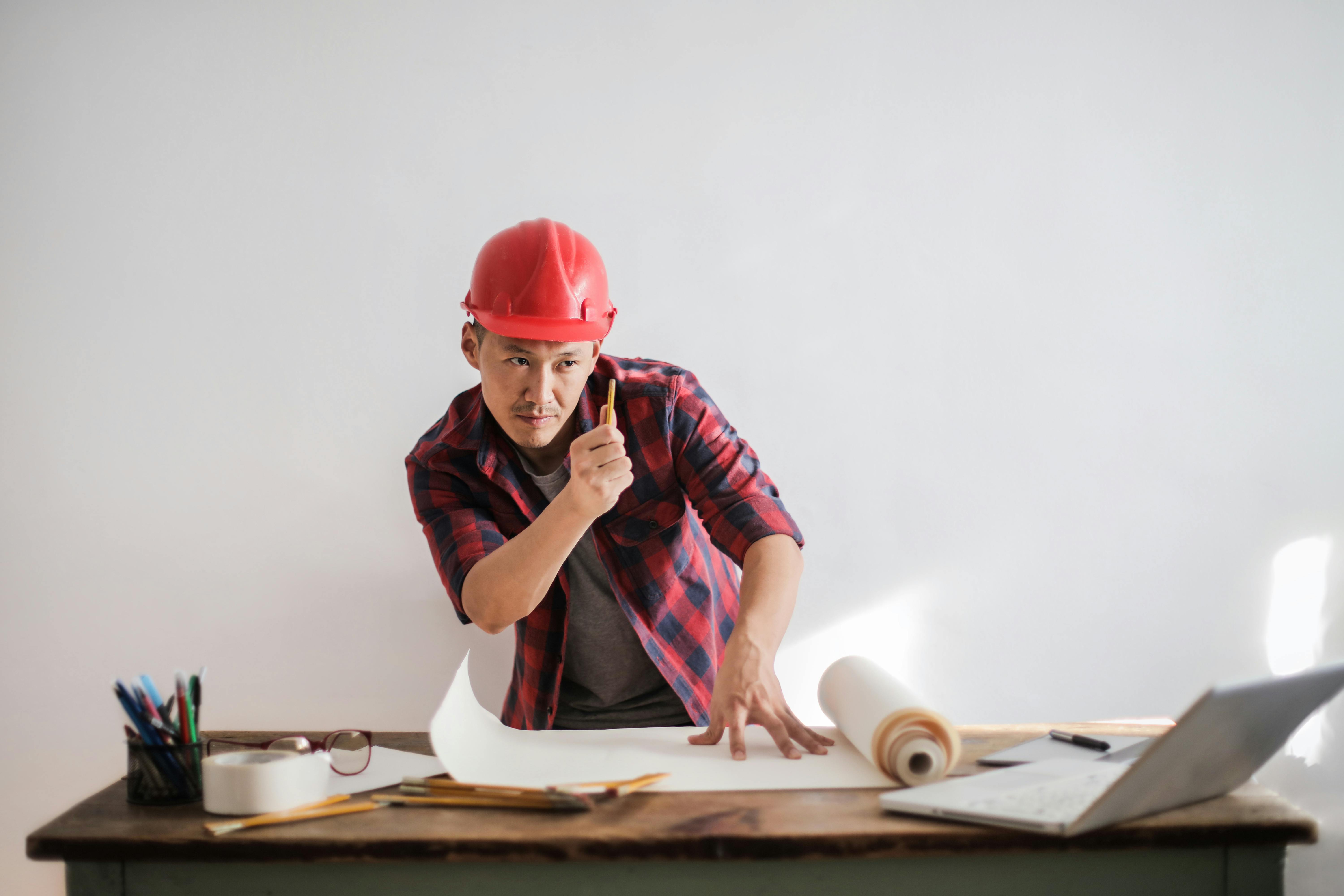 man holding incandescent bulb