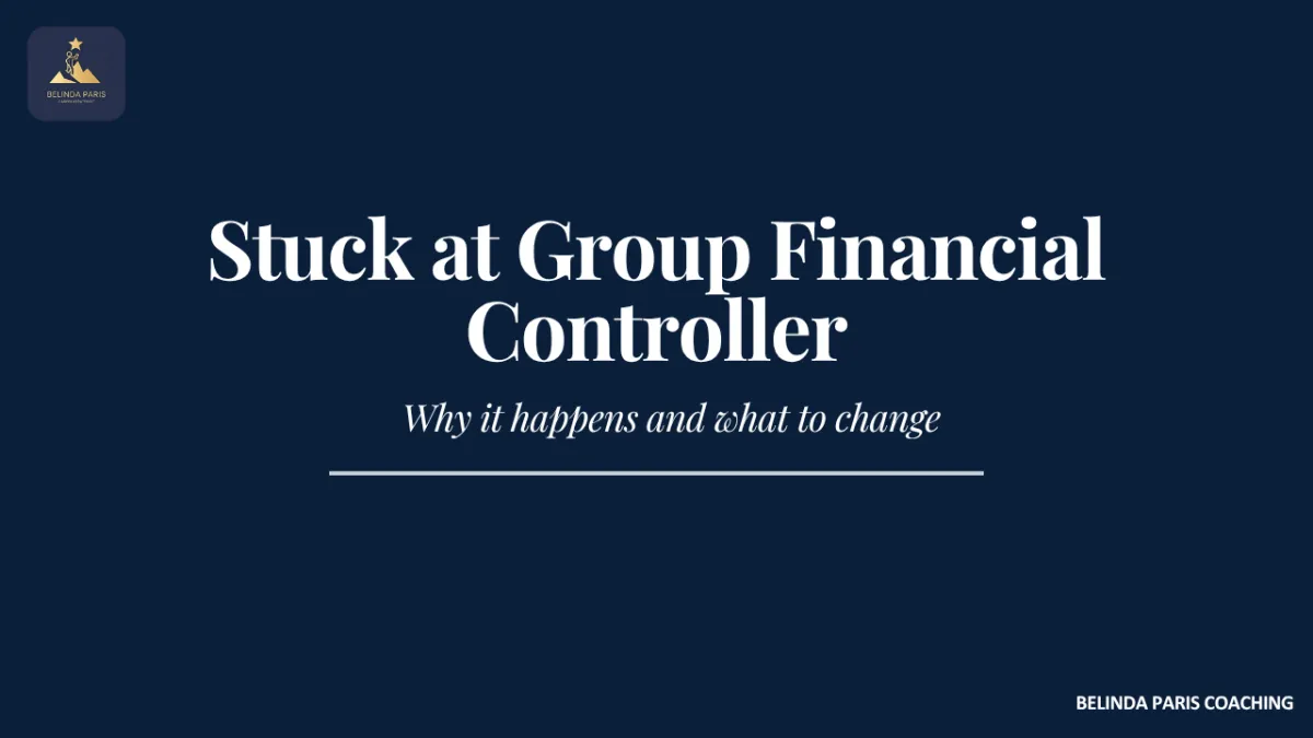 Group Financial Controller looking out an office window thinking about career progression