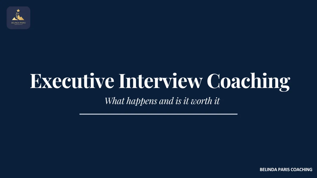 Senior executive practising interview answers with a coach in a quiet meeting room