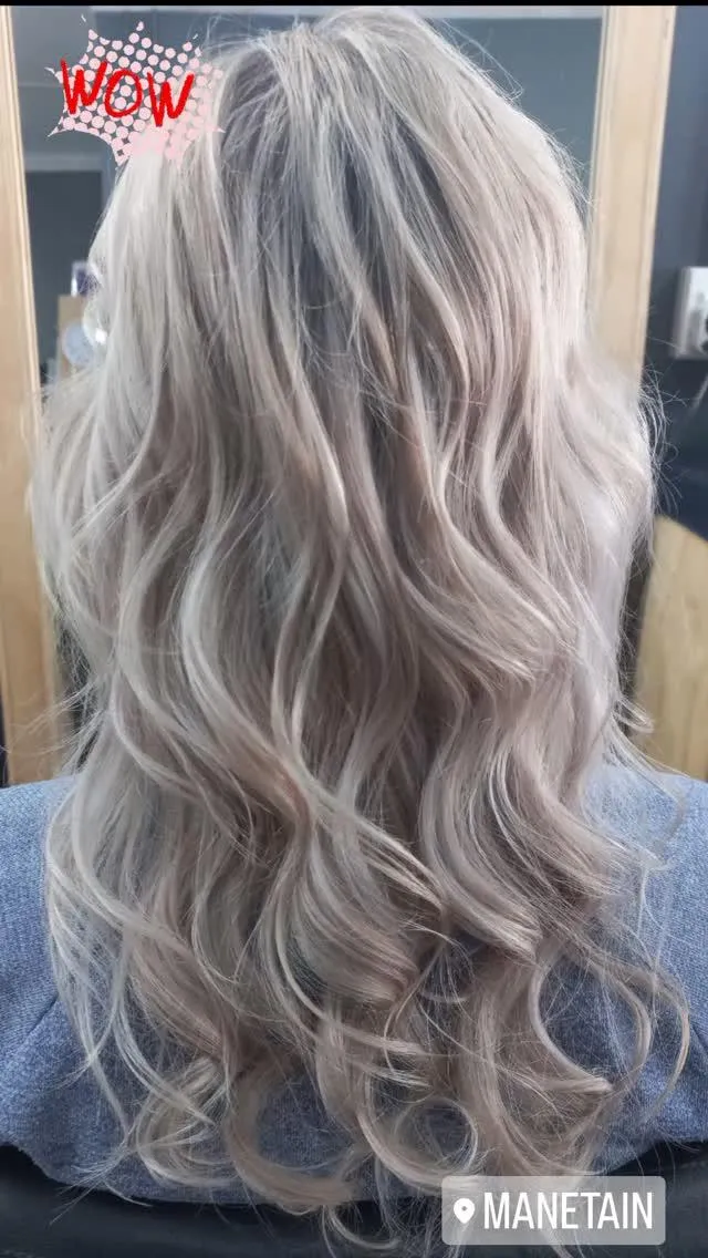 Backside of a blonde woman's hair that has been curled