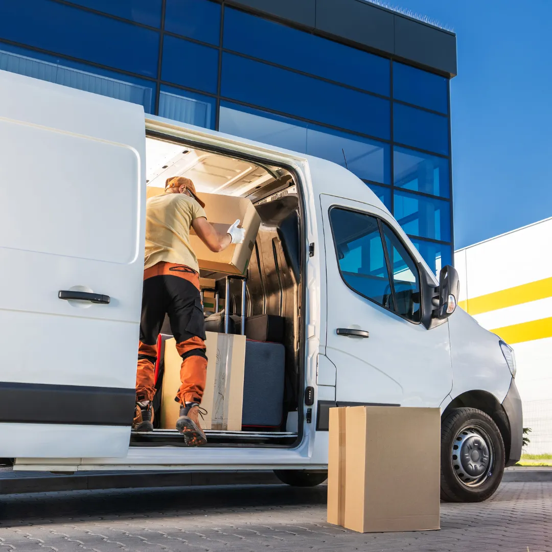 man loading cargo on shop van