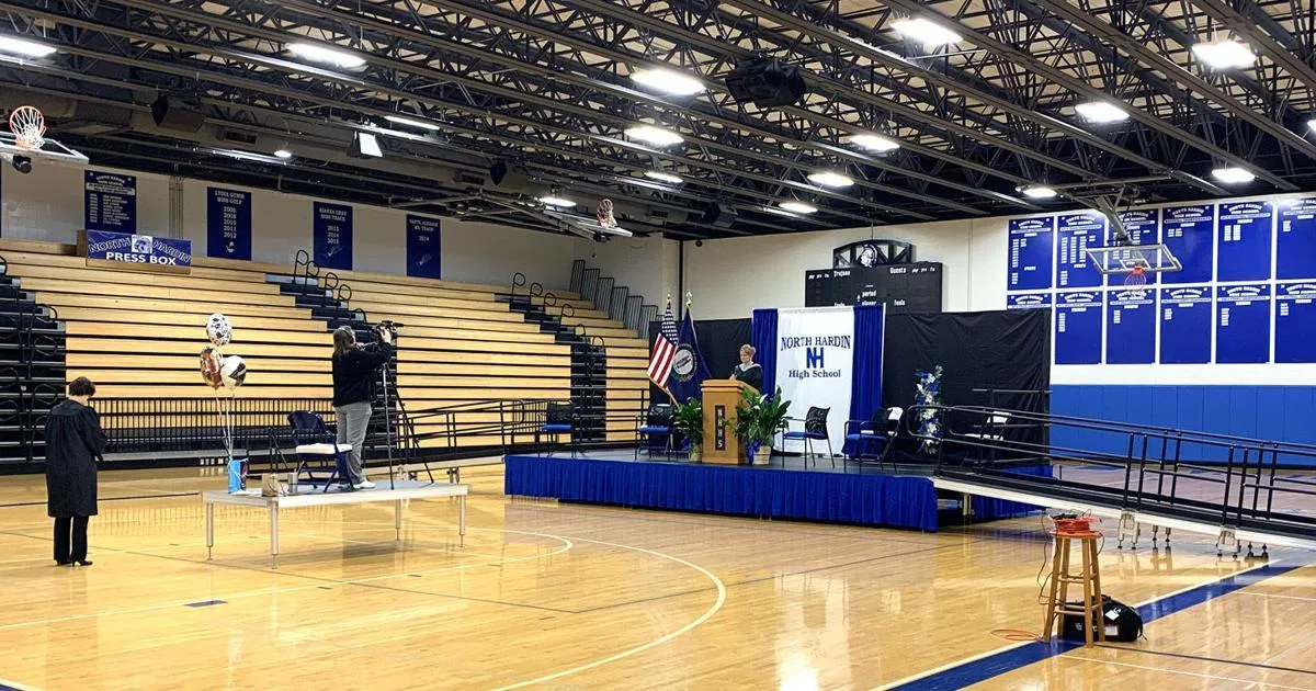 person holding woman's hand beside sea while facing sunlight