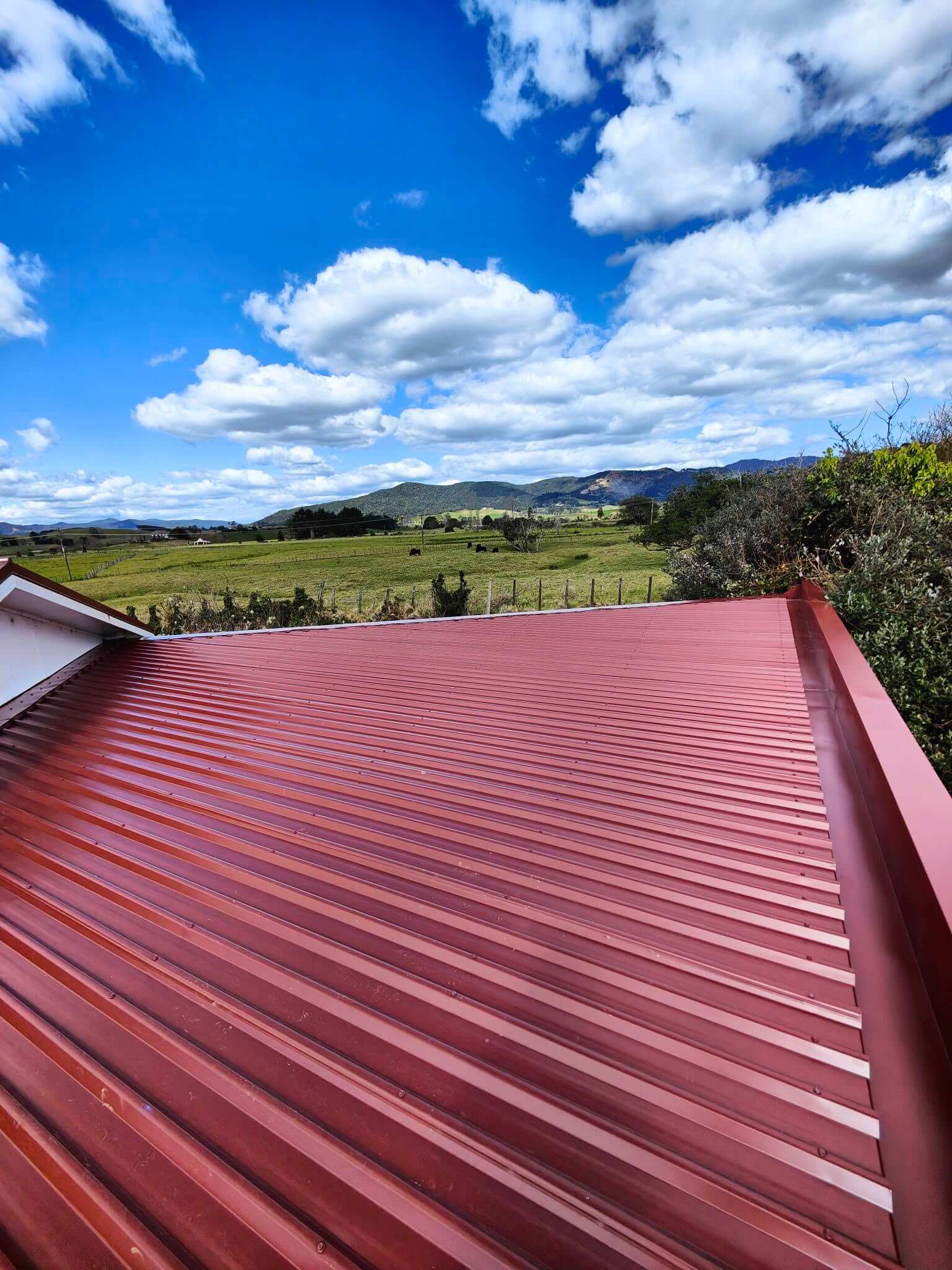 Roof flashings and ridge caps on a Far North roofing project
