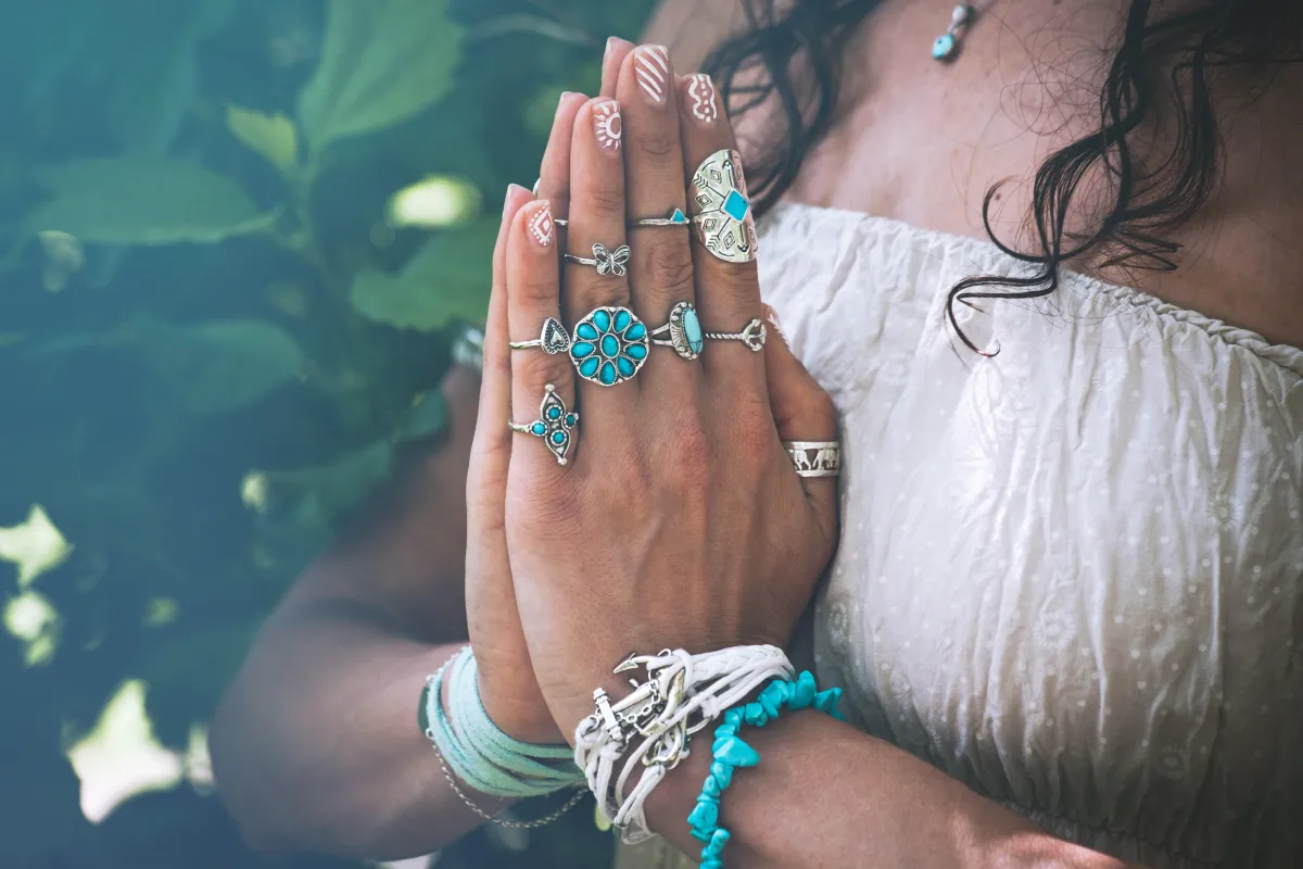 woman with hands on heart in meditation postion