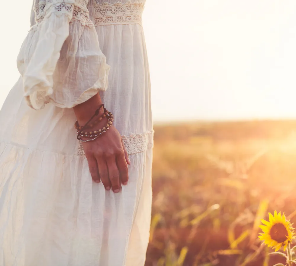 woman with hands on heart in meditation postion