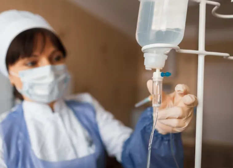 Nurse in a hospital ward checks the counter drops.