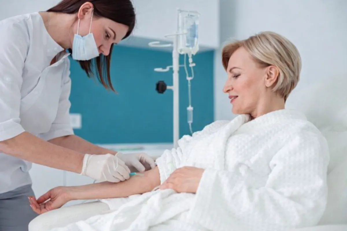 Woman having an IV drip in a spa-clinic