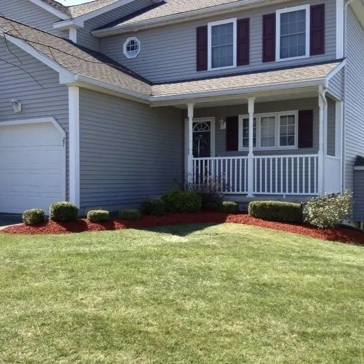 Finished residential landscaping with fresh mulch and landscape beds