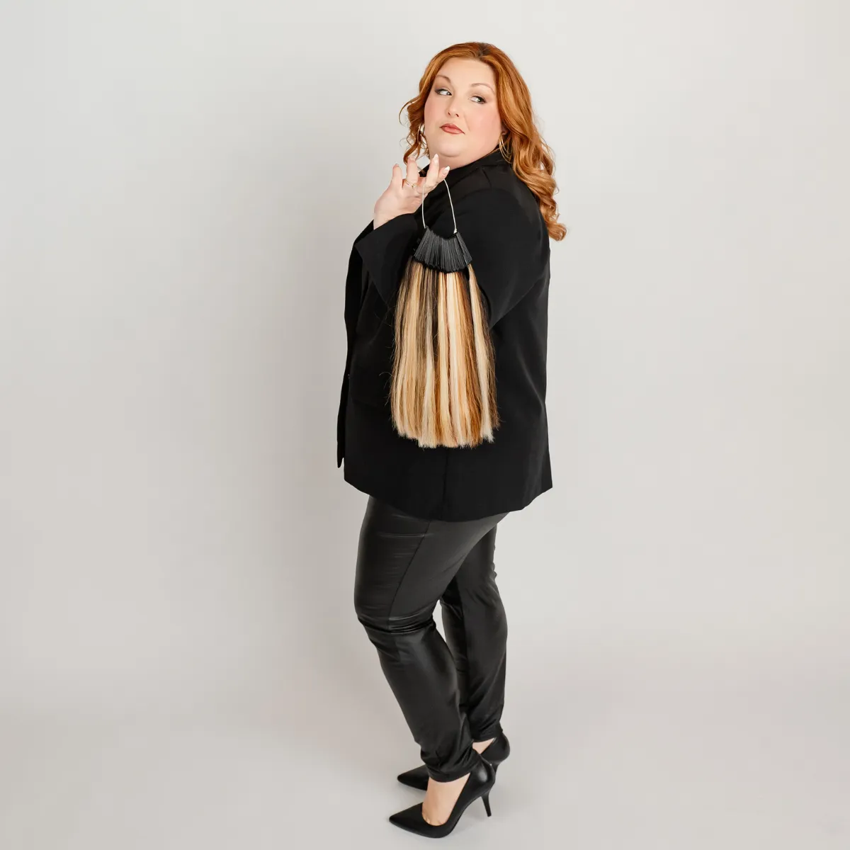 Full-body portrait of Brooke showcasing long, seamless luxury hair extensions designed for fullness and confidence