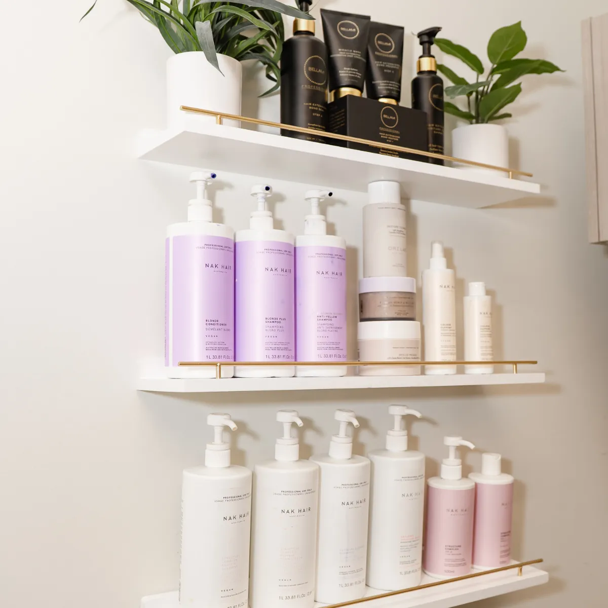 Curated professional haircare products displayed inside Conceited Beauty Bar’s private studio in Lancaster Pennsylvania