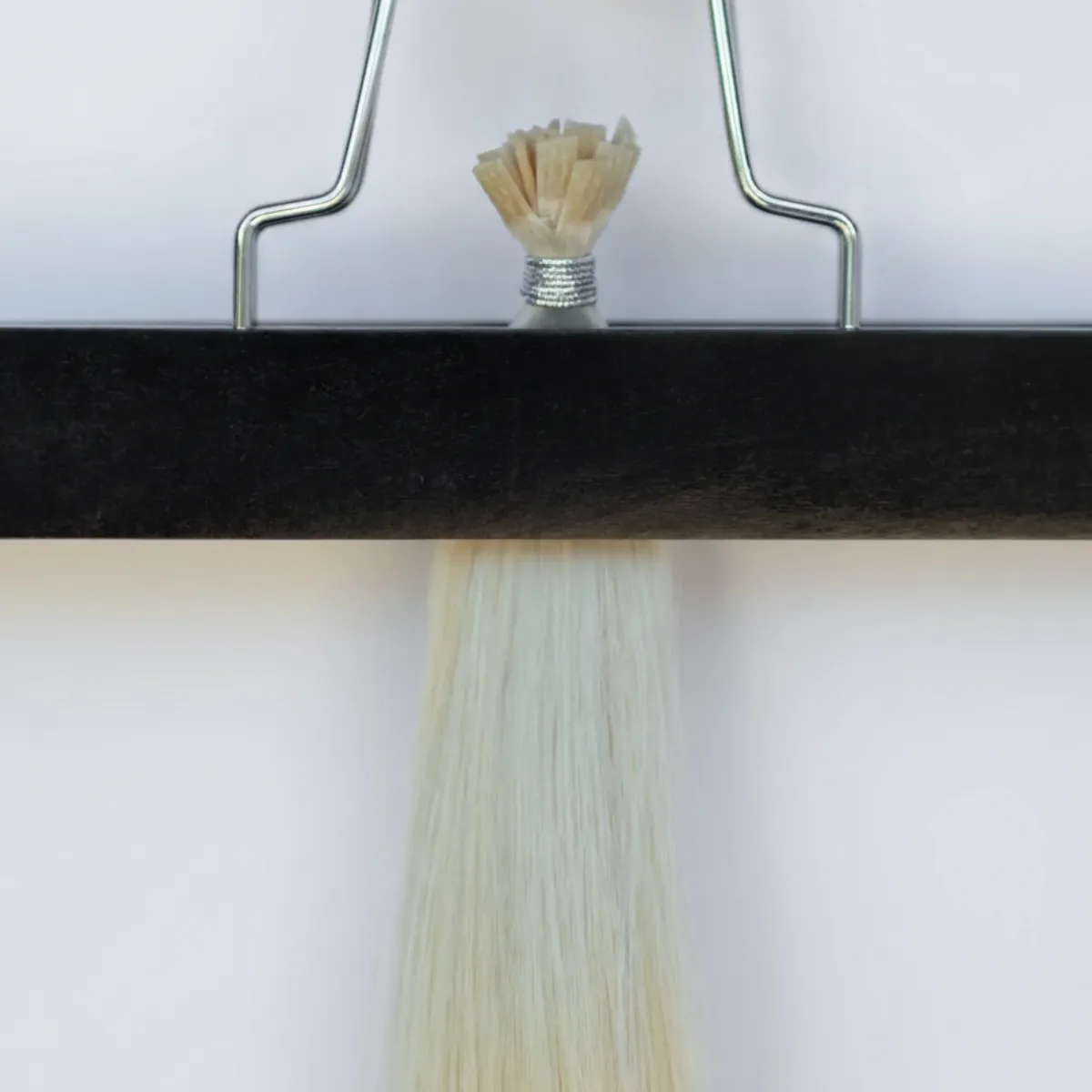 Close-up of a K-Tip (Keratin Tip) hair extension bond for a seamless, long-lasting blend