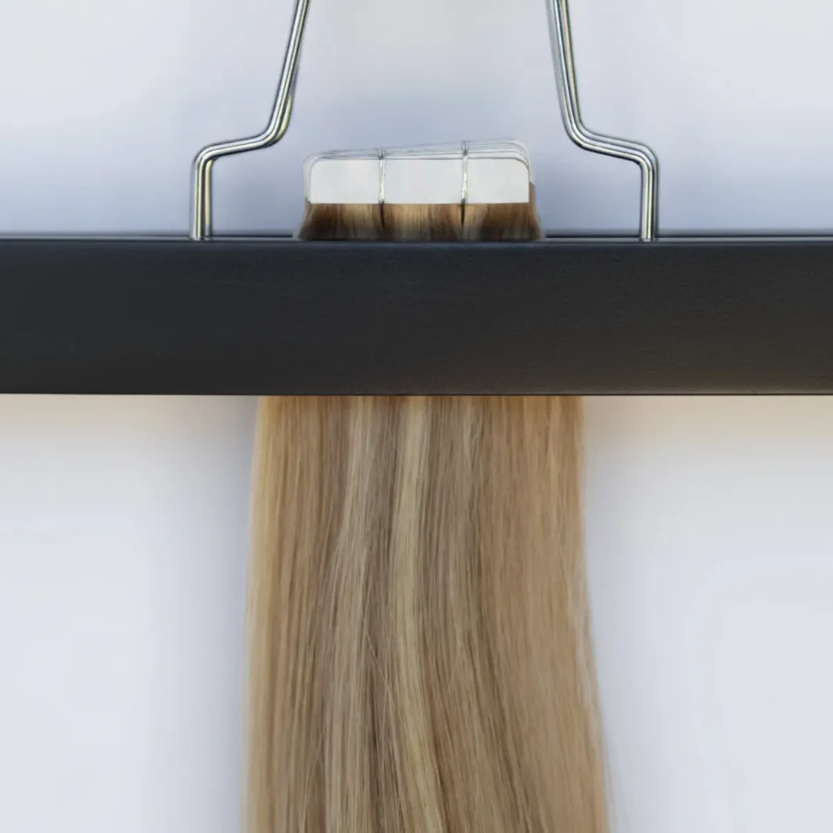 Close-up of I-Tip hair extensions secured with small micro beads for a heat-free, keratin-free installation