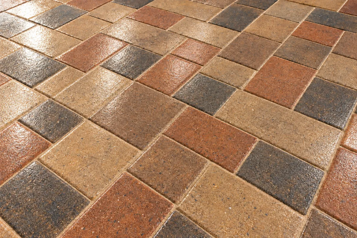 Super wet high-gloss paver finish reflecting architectural light with gold-standard seal