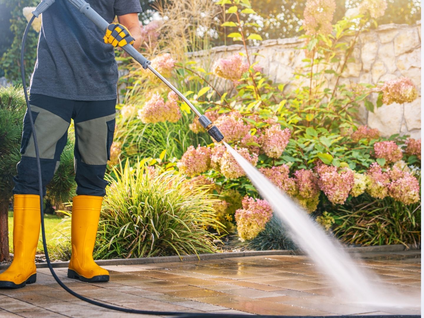 Pressure washing service cleaning outdoor surfaces