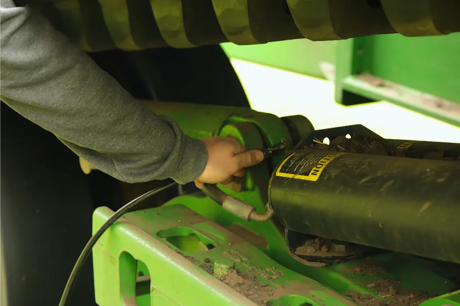 landscape photography of grass field with windmills under orange sunset
