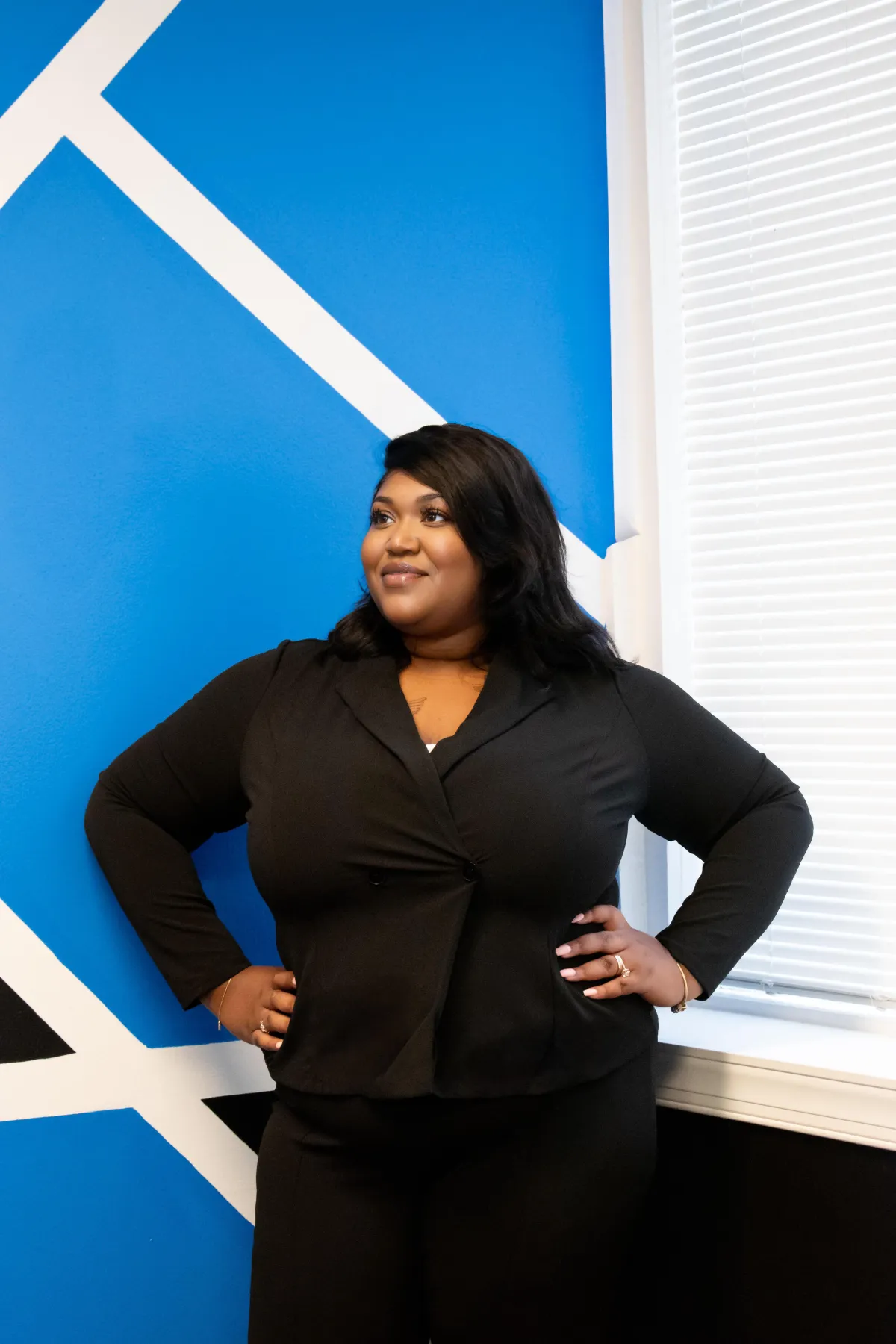Confident mentor reviewing a planning checklist on a tablet in a modern studio setting