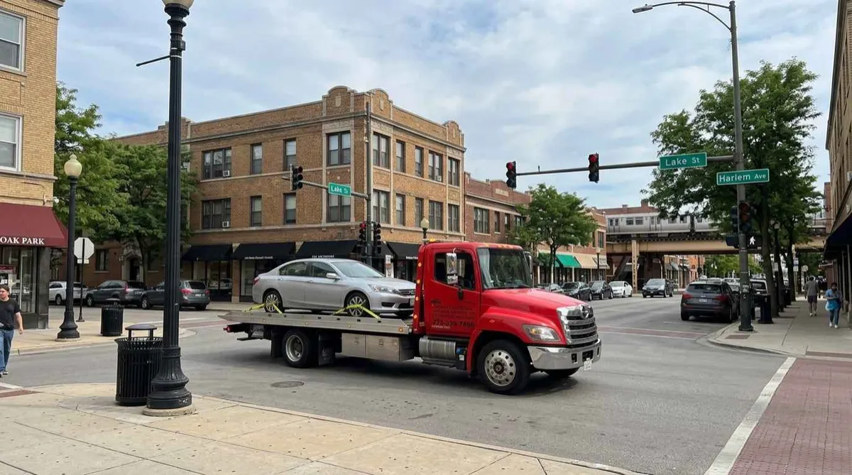 Flatbed tow truck on Lake Street in Oak Park IL near Harlem Avenue