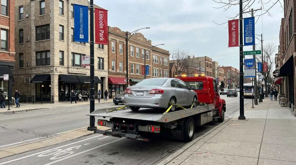 Tow truck parked on N Clark Street near DePaul University, Lincoln Park Chicago