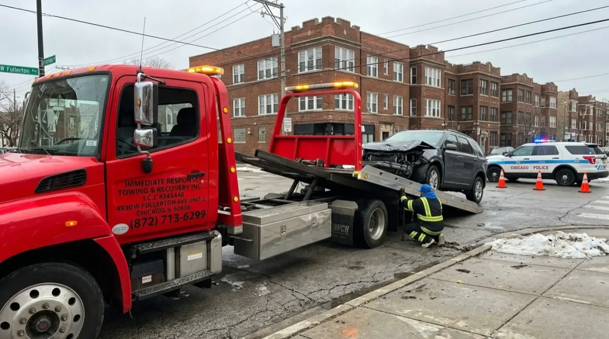 Tow truck performing emergency recovery after accident