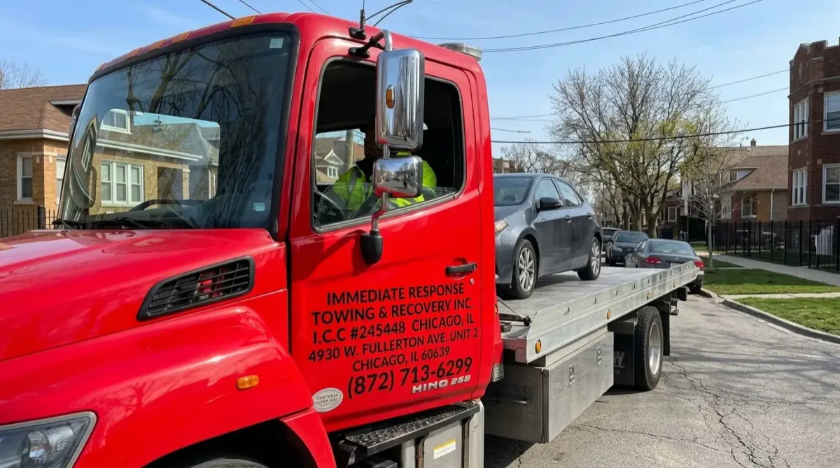 Light-Duty Local Towing- Tow truck towing car in Portage Park