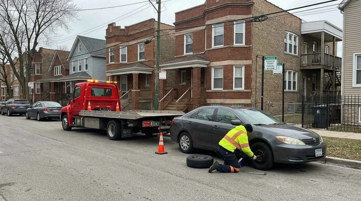 Flat tire change on a residential street in Hermosa, Chicago